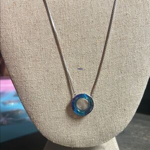 sterling silver necklace features a blue Austrian crystal wishing ring pendant